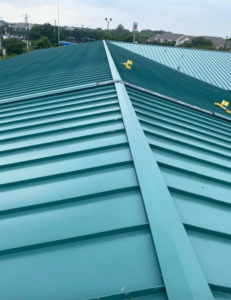 Green commercial metal roof ridge and valley for Metal Roof Repair in Halfway