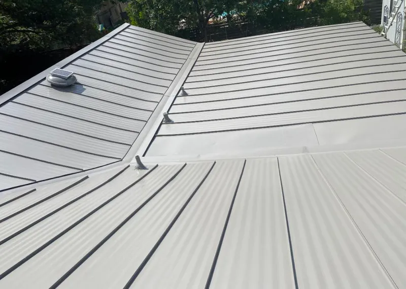 Solar attic fan installed on a metal roof for Roof Ventilation in Halfway